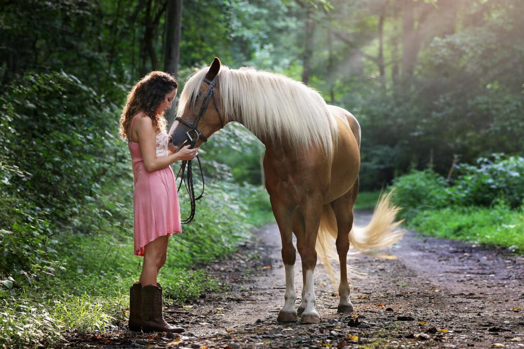 pexels-photo-1090408-1090408 Woman Wearing Pink Dress Standing Next to Brown Horse